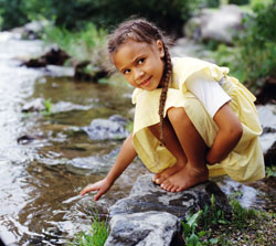 Girl by stream